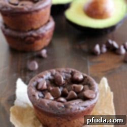 Velvet Chocolate Avocado Muffins 2 A single fudgy chocolate avocado muffin on a plate