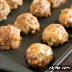 Perfectly baked golden-brown meatballs, ready for serving.