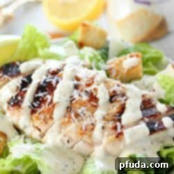 Chargrilled Chicken Caesar 2 Grilled Chicken Caesar Salad for a yummy summertime lunch or dinner! With a simple yogurt marinade recipe, this grilled chicken is tender and delicious. Served over romaine lettuce, homemade croutons, shaved parmesan and caesar dressing - YUM!!