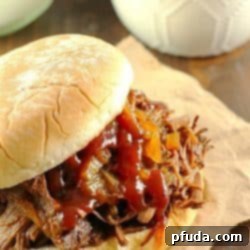 Slow Cooker Shredded Beef Sandwiches are one of my family's favorite make-ahead dinners! Cooked right in the crock pot with an easy & flavorful sauce, makes this beef roast tender and perfect for filling sandwiches/buns! Great to serve for dinner or for a party!
