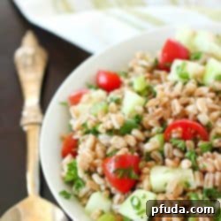 Farro Salad full of tender farro, tomatoes, cucumber, green onions, parsley, and tossed in an olive oil & lemon dressing.