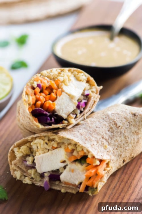 Thai Style Peanut Chicken Cauliflower Rice Wraps, a healthy Starbucks copycat with chicken, carrots, cabbage, cauliflower rice, and Peanut Coconut Sauce.