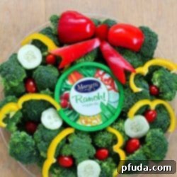 Turn your boring veggie tray into something cute for the holidays with this Christmas Wreath Holiday Veggie Tray! It's simple to make but will leave a lasting impression on your guests at any holiday party! AD