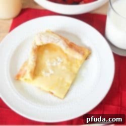 Fluffy German Pancakes, Homemade Syrup 2 German Pancakes with homemade syrup! These are so easy - one pan to make a huge amount of pancakes!