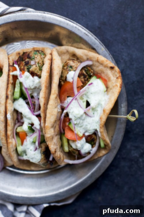 30 Minute Greek Turkey Meatball Gyros topped with a classic Tzatziki Sauce you’ll want to swim in! These Gyros are the perfect healthy dinner option for the family and clock in 429 calories! Woohoo!