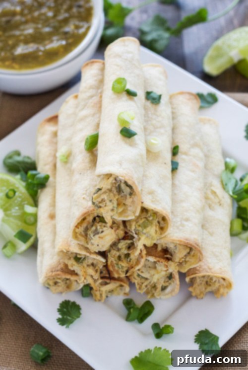 Baked Green Chile Chicken Taquitos are healthier and stuffed with the creamiest chicken and green chile filling!
