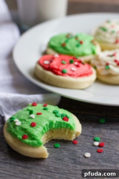 Soft, cakey, and frosted Copycat Lofthouse Sugar Cookies with colorful sprinkles.