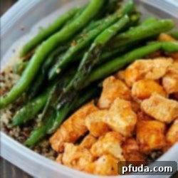 Zesty Lime Chicken Meal Prep Bowls 2 A vibrant meal prep bowl featuring perfectly baked chili-lime chicken alongside quinoa and fresh green beans.