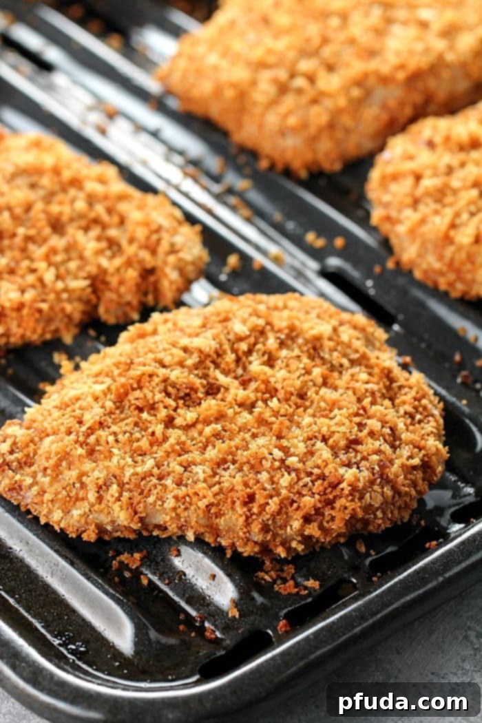 Best Ever Crispy Baked Breaded Pork Chops - Golden brown and perfectly cooked