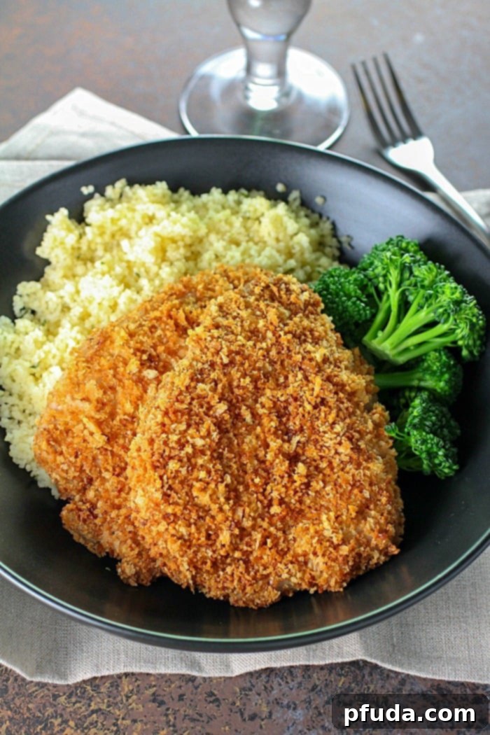 Incredible Crispy Baked Breaded Pork Chops - Close-up of golden brown breading