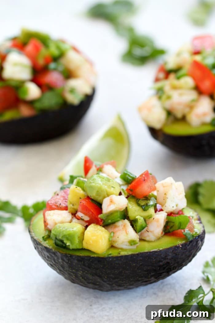 Quick & Easy Avocado Shrimp Ceviche Recipe with a Mexican twist! Fresh shrimp and avocado ceviche in avocado halves.