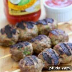 Italian Meatball Skewers 5 Flavorful Skewered Italian Meatballs, grilled to perfection and ready to serve.