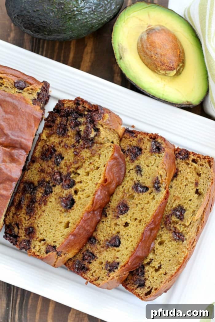 Adding ripe avocados into this Chocolate Chip Banana Avocado Bread makes it extra moist, incredibly tender, and surprisingly healthy! I promise you can't tell there's avocado in it – it just tastes delicious and decadent!