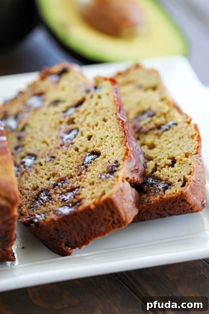 Looking for a healthier quick bread recipe? This Chocolate Chip Banana Avocado Bread is packed with incredible flavor and boasts an irresistibly soft, moist texture thanks to the addition of creamy avocados, all without extra oil or butter!