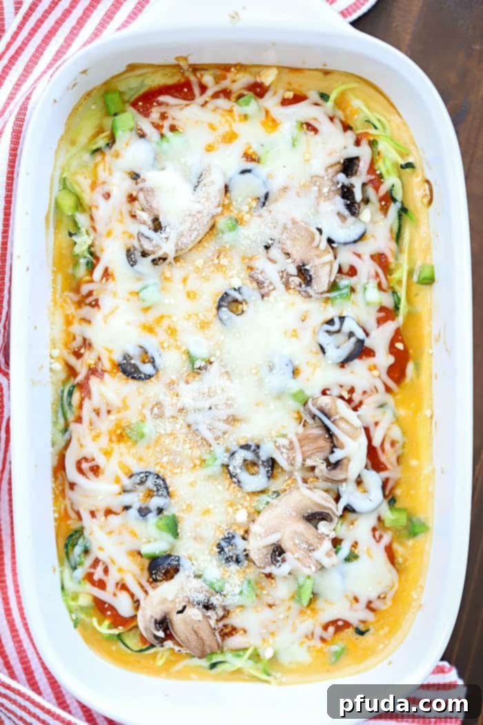 Delicious and healthy Zoodle Pizza Casserole, a low-carb alternative to traditional pizza, packed with savory flavors and fresh toppings.