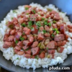 Hearty Cajun Red Beans & Rice 3 Spice your dinner up tonight and make this Cajun Red Beans and Rice Recipe! Slow cook beans, ham, turkey sausage and spices in a skillet to let the flavors combine. Serve over rice for a delicious dinner the whole family will fall in love with!