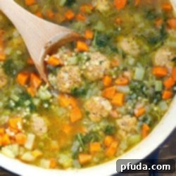 We can't get enough of this Italian Wedding Soup Recipe! It's quick, easy and absolutely delicious!