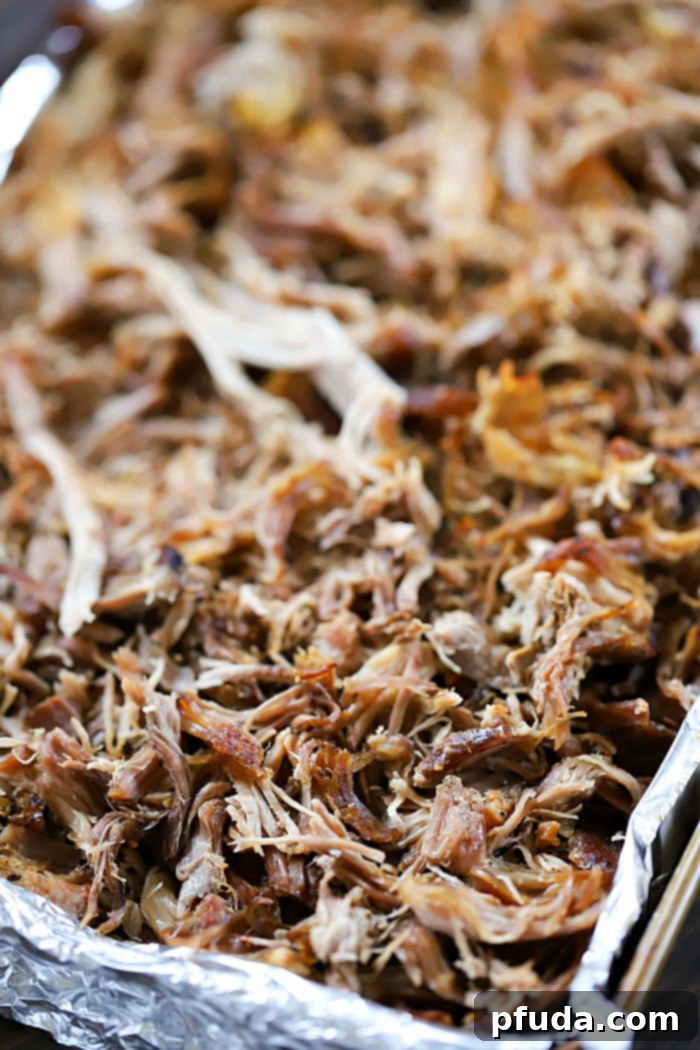 The Ultimate Pulled Pork Sandwich Recipe 4 Slow-roasted pork butt, shredded and ready for making the ultimate pulled pork sandwiches.