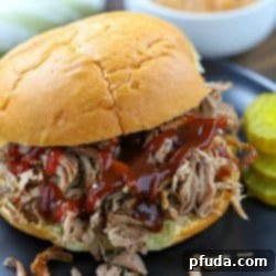 The Ultimate Pulled Pork Sandwich Recipe 5 Close-up of a juicy pulled pork sandwich, highlighting the ease and deliciousness of this oven-baked recipe.