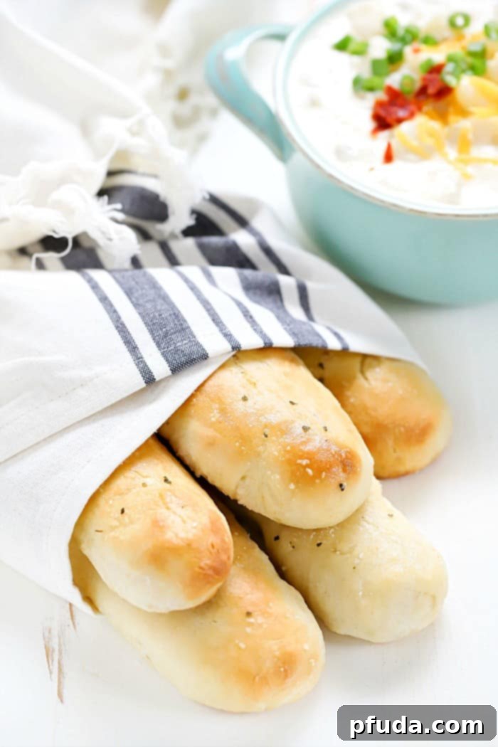 These Easy Homemade Breadsticks are SO good! Serve as a yummy side dish with any meal!