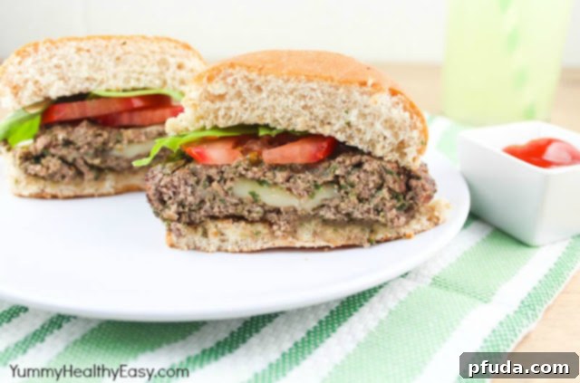 Pesto-Packed Cheese Melt Burger 6 Pesto burger with a bite taken out, showing melted cheese