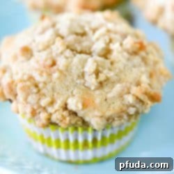 Irresistible Banana Streusel Muffins 2 Close up photo of a banana muffin on a blue plate.
