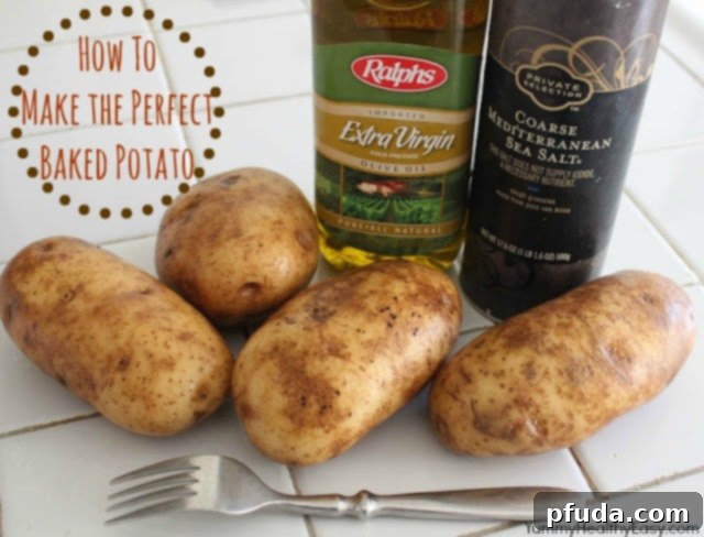 Golden brown, perfectly baked potato on a baking sheet, ready to be cut open.