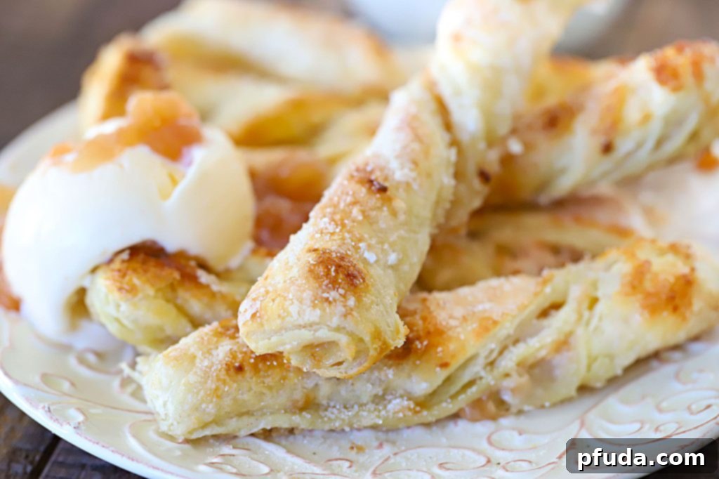 Cinnamon Apple Strudel Spirals 2 Apple Strudel Twists with a side of vanilla cream.