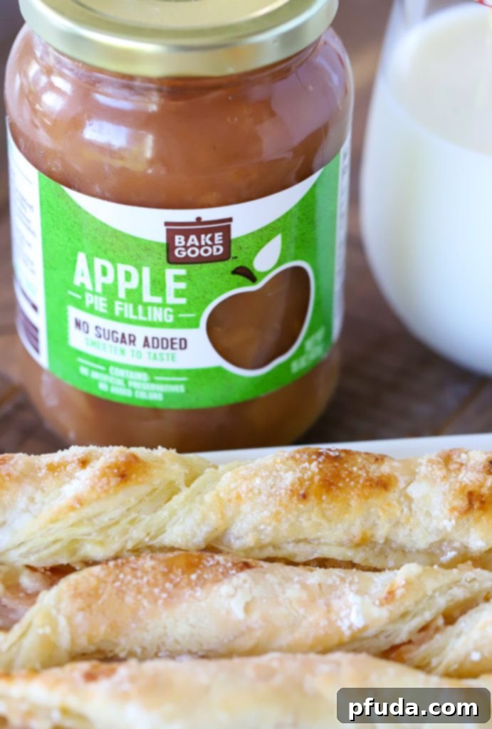 Cinnamon Apple Strudel Spirals 3 Apple Pie Filling behind a plate of apple pastries.