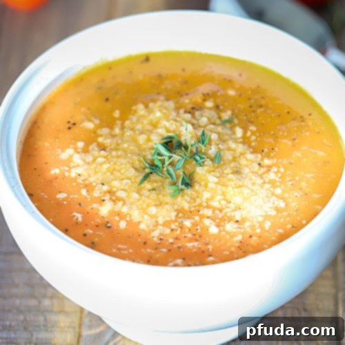 Effortless Tomato Soup 2 Bowl of soup topped with herbs.