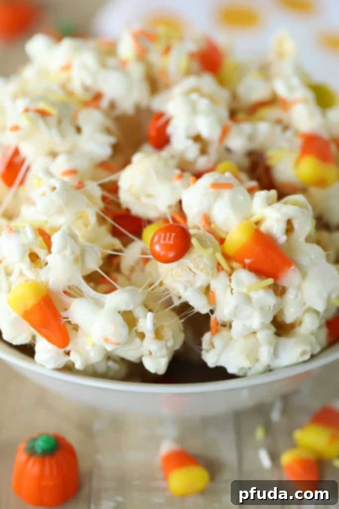 No Bake Candy Corn Popcorn Clusters 2 Bowl full of Popcorn Treats with Candy Corns, a perfect fall snack