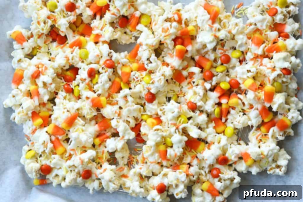 No Bake Candy Corn Popcorn Clusters 3 Marshmallow Popcorn Treats with Candy Corns artfully arranged on a platter for a party