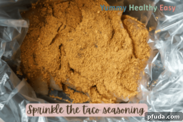 Easy Slow Cooker Low-Sodium Shredded Taco Chicken 5 Chicken breasts in slow cooker sprinkled with taco seasoning.