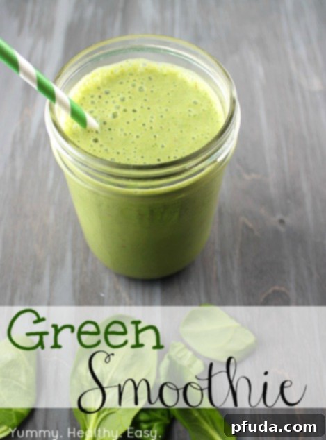 Vibrant green smoothie in a glass with a straw