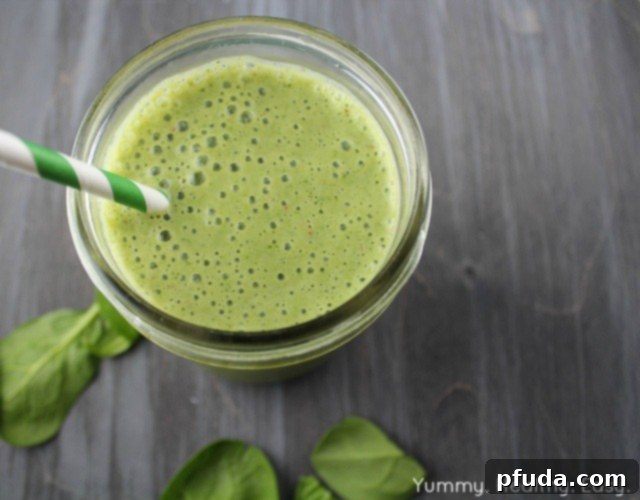 Ingredients for a healthy green smoothie laid out on a table