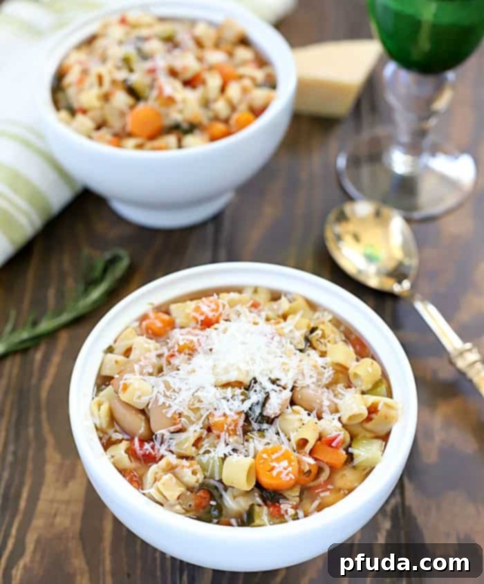A close-up shot of a steaming bowl of Crock Pot Minestrone Soup, highlighting the rich broth, tender vegetables, and small pasta, inviting you to try this amazing slow cooker recipe.
