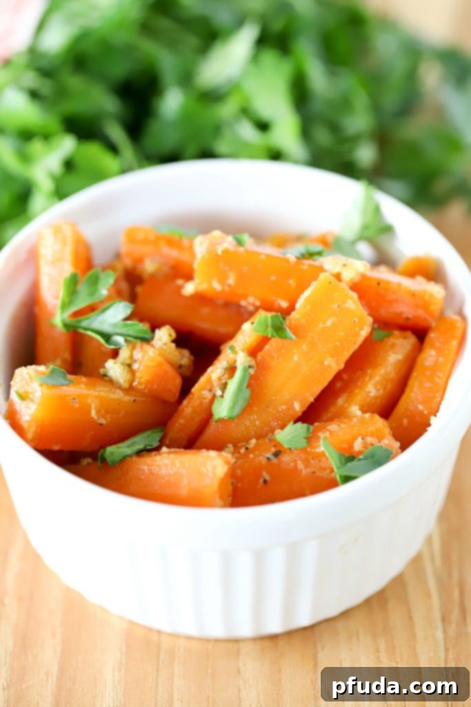 A bowl filled with perfectly cooked, glistening brown sugar glazed carrots, ready to serve.