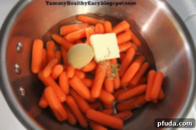 Step-by-step instruction: Water, salt, and pepper have been added to the pan with the carrots and other ingredients, before bringing to a boil.