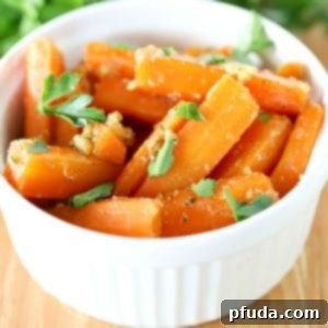 square image of a white bowl filled with glistening brown sugar glazed carrots.