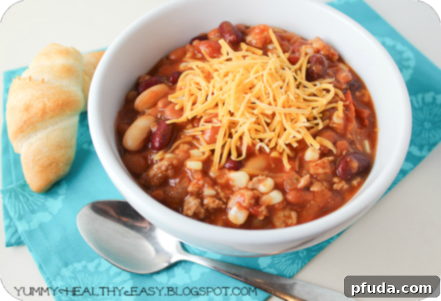 A final photo showcasing a beautifully plated bowl of Turkey Taco Chili with a spoon, ready to be enjoyed.