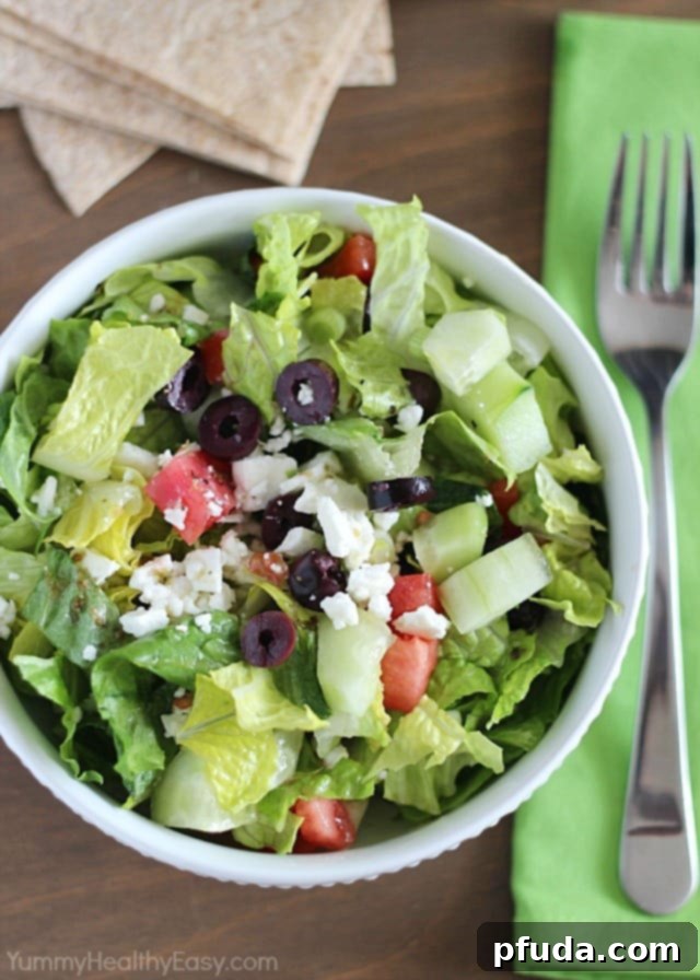 Easy Greek Salad tossed with homemade dressing and feta cheese