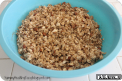 Pouring melted honey and butter over the oat mixture and stirring