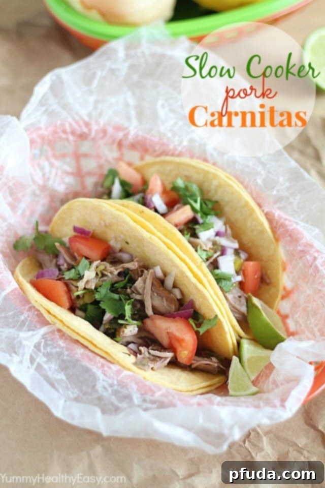 Delicious Slow Cooker Pork Carnitas served on a tortilla with fresh cilantro and onion