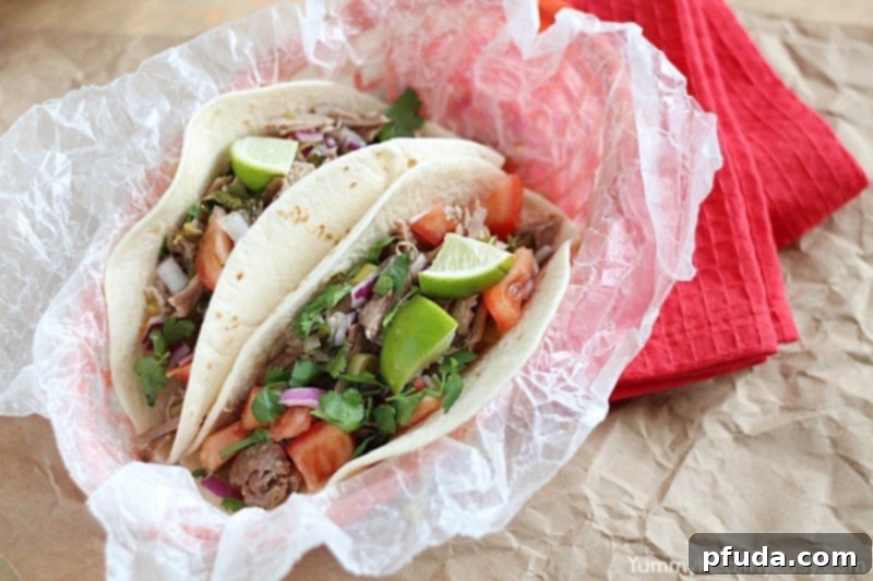 Close-up of succulent shredded pork carnitas ready for tacos