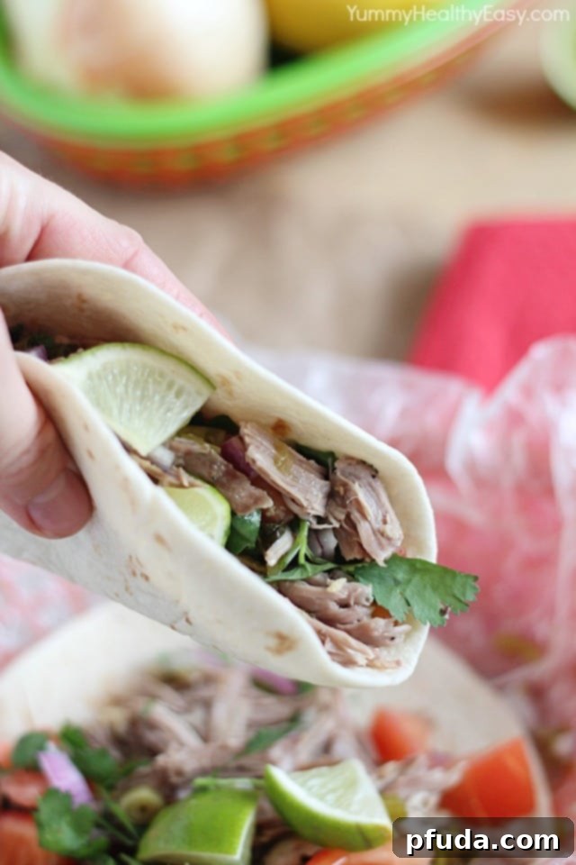 Pork Shoulder roast with spices and green chilies in a slow cooker