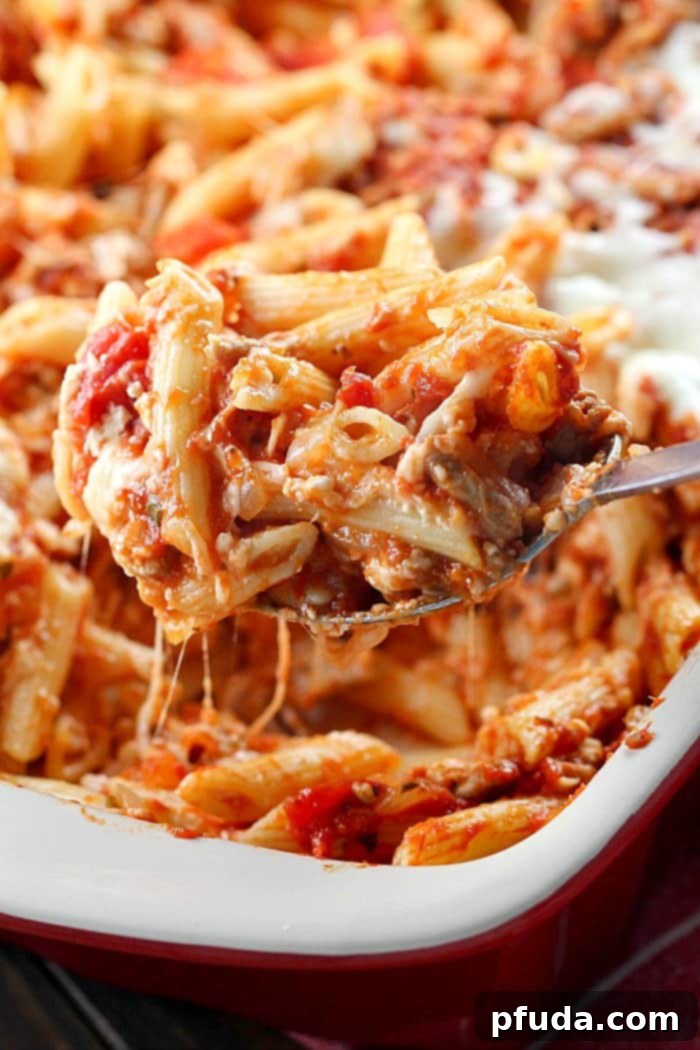 Skinny Cheesy Pasta Bake is a delicious layered casserole made lighter by using ground turkey and whole wheat pasta!