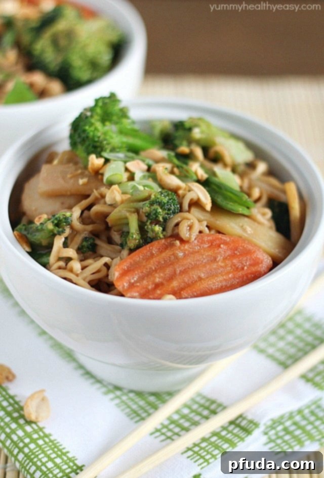 A new spin on ramen noodles - Chicken Thai Noodle Bowls! Ramen noodles and stir-fry veggies tossed in a quick & easy peanut sauce and topped with chopped peanuts and green onions. Bye bye boring ramen!