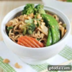 A new spin on ramen noodles - Chicken Thai Noodle Bowls! Ramen noodles and stir-fry veggies tossed in a quick & easy peanut sauce and topped with chopped peanuts and green onions. Delicious!
