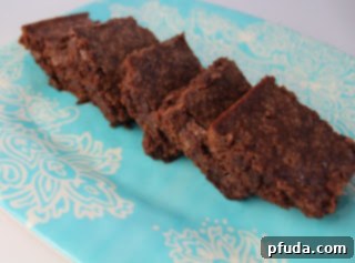 Stacked fudgy brownies displaying their rich chocolate color and perfect texture