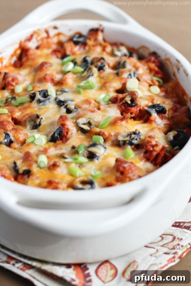 Simple Layered Enchilada Bake Enchilada casserole layers with ground meat, tortillas, and cheese